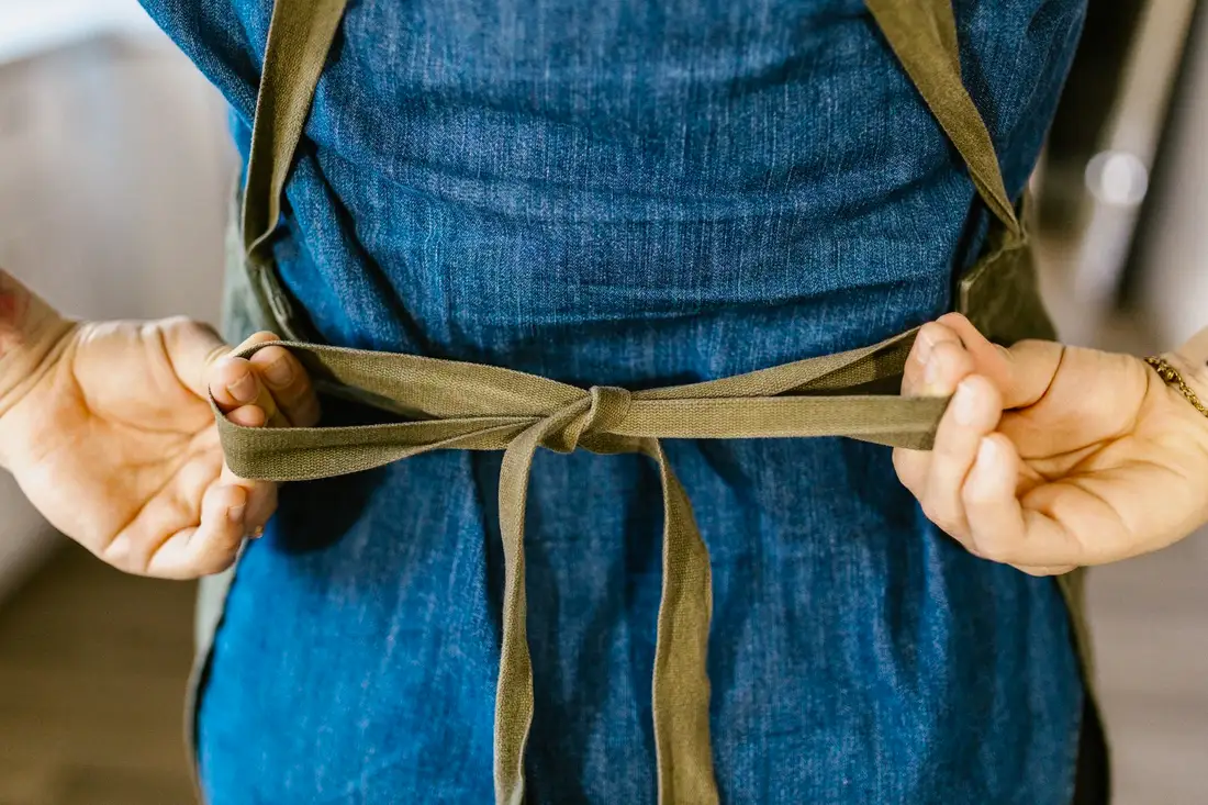 Detail of an apron pocket and stitched seam